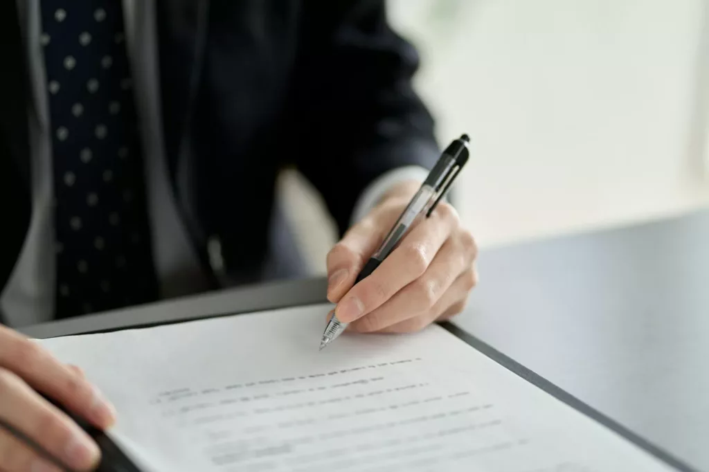 Asian businessman signing a contract